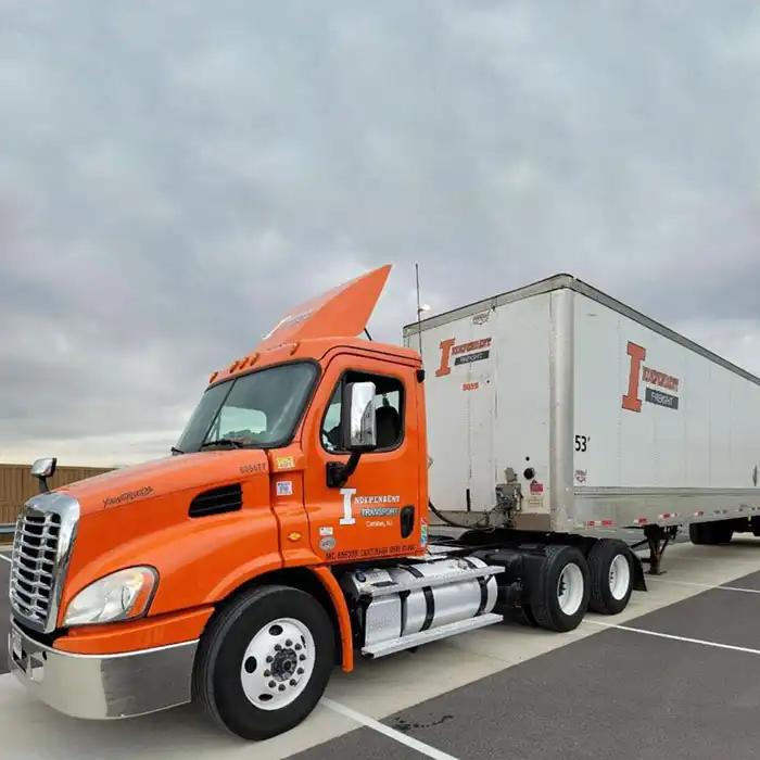 Independent Logistics freight truck with orange cab