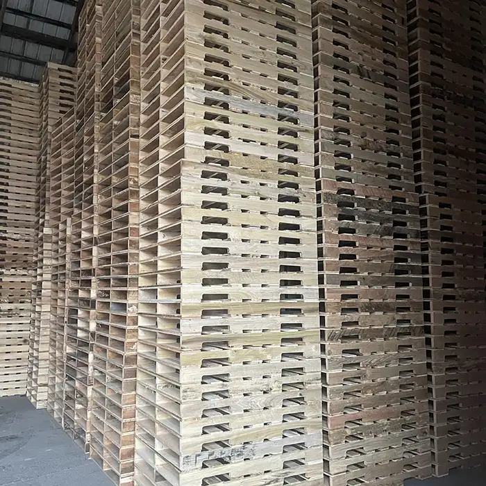 stacks of wood pallets in warehouse
