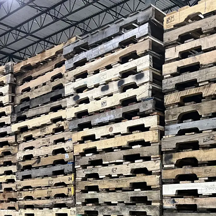 stacks of wood pallets in warehouse