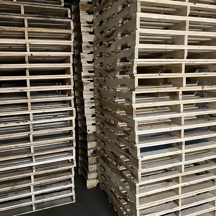 stacks of wood pallets in warehouse