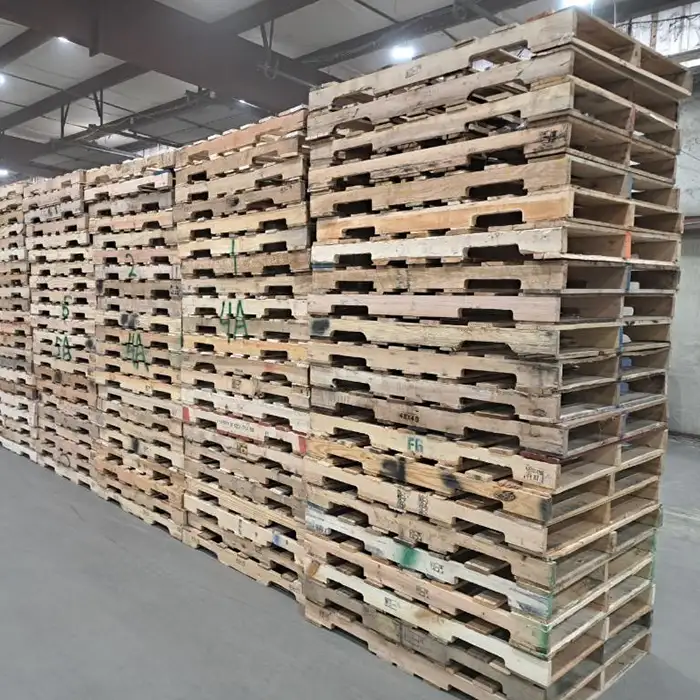 stacks of wood pallets in warehouse